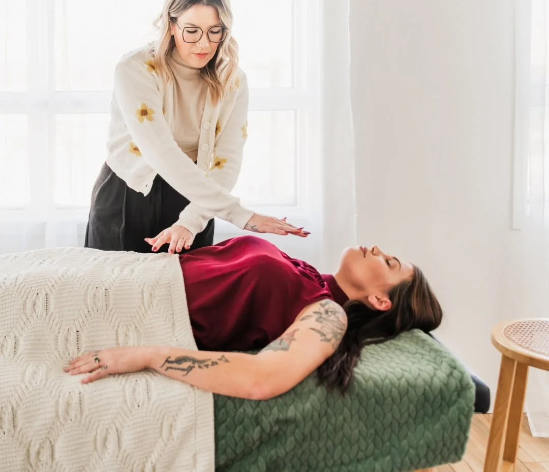 Jessica performing a Reiki and hypnotherapy session at Sacred Beauty Collective